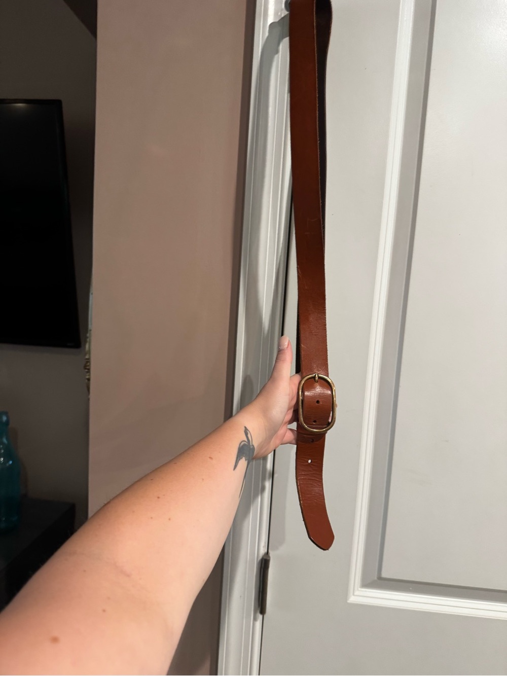 Anthropologie dark brown leather strap with gold foil logo